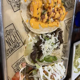 Camaron taco, Philly cheesesteak taco, and American beef taco