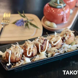 Crispy on the outside, soft inside--takoyaki bursting with flavor, topped with creamy mayo and savory bonito flakes.
