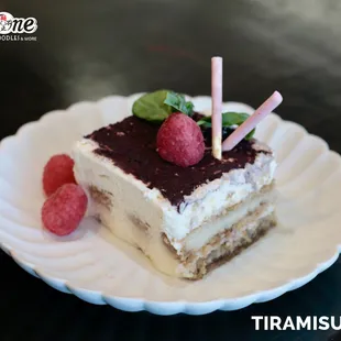 A slice of pure indulgence!  Creamy, dreamy Tiramisu layered with rich flavors and a hint of cocoa delight.
