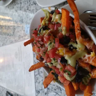 a plate of fries and a salad