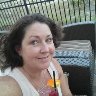 Enjoying the ocean breeze on the outdoor patio with a specialty drink.