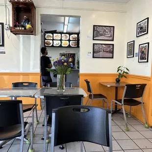 a dining area with tables and chairs