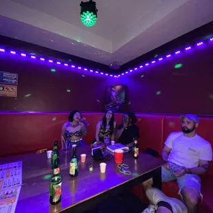 a group of people sitting around a table