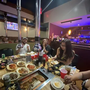 a group of people eating at a restaurant