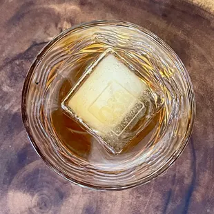 a square of ice in a glass