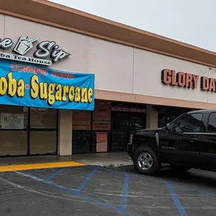a truck parked in front of the store