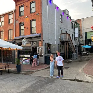 two people standing in the street