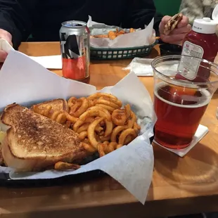 a basket of french fries and a sandwich