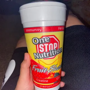 a person holding a plastic cup