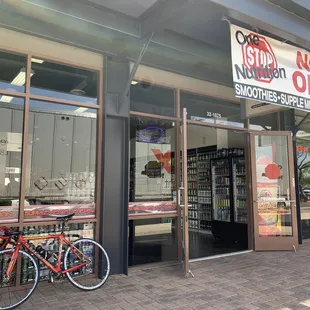 a bicycle parked outside a store