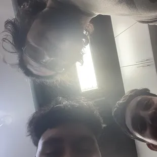 a man and a woman looking up at the camera