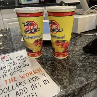 two cups of yogurt on a counter