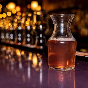 a pitcher of tea on a bar