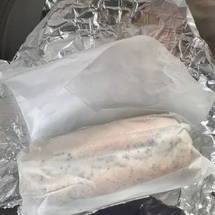 a hot dog wrapped in foil