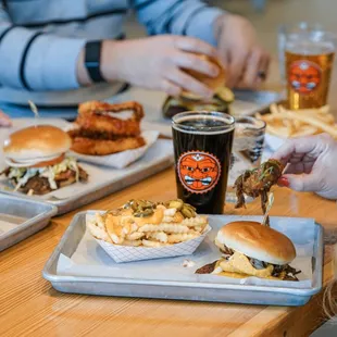a group of people eating burgers and fries