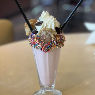 an ice cream sundae with sprinkles