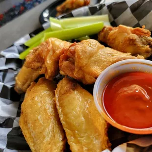 8 jumbo sized wings with hot datil pepper sauce.