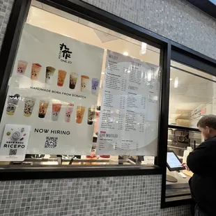 a man standing in front of a window