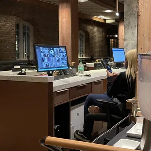 The "security guard," oblivious to everything except her cell phone.