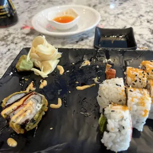 Half Crunchy roll almost gone and a California Roll