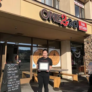 a woman holding a certificate