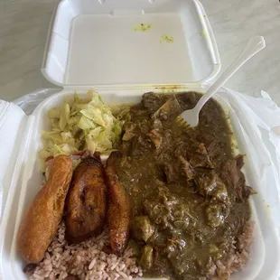 Curry goat, rice and beans, cabbage, plantains festival