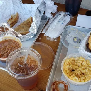 DLT, baked beans, spicy brisket sandwich, mac&apos;n&apos;cheese, and an iced tea.  Yummy.