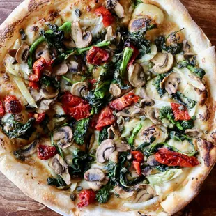 Vegan Pie with Roasted Garlic Spread, Preserved Tomatoes, Mushrooms, Roasted Fennel, Broccoli Rabe, Capers