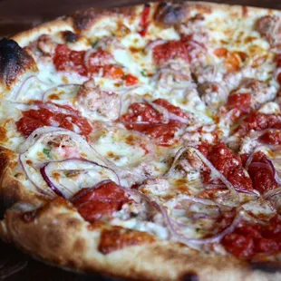 Sausage Pizza with House Made Italian Sausage, Red Onion, Sweet Peppers, Crushed Tomato, Mozzarella, Garlic Oil