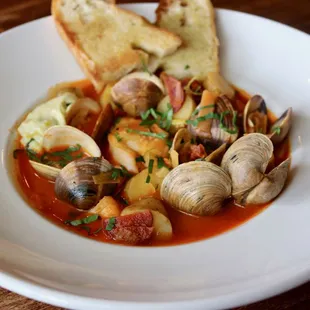 Cod &amp; Clam Stew with Piquillo Pepper Broth, Potatoes, Chorizo, Fennel, Leeks, Aioli, Grilled Focaccia