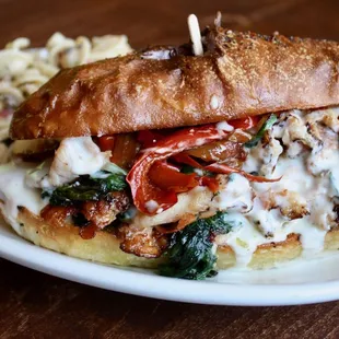 Lunch Sandwich Special with Canadian Bacon, Sauteed Peppers &amp; House Made Cheese Sauce.