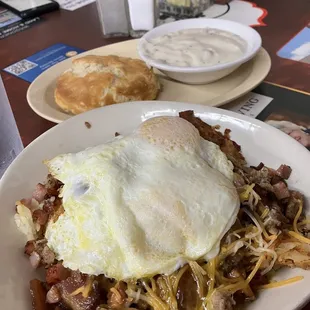 Meat lovers skillet with biscuit and gravy