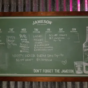 a chalkboard with a list of drinks