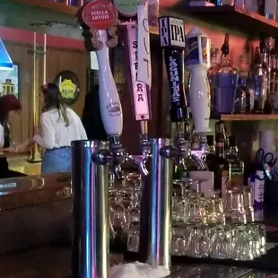 a bar with several beer taps