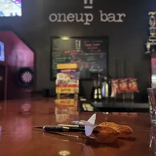 a glass of wine and a biscuit on a bar