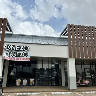 the front of a restaurant with a motorcycle parked in front of it
