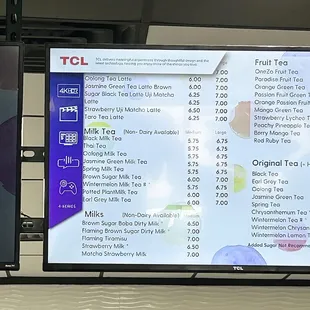 a menu on a large screen in a restaurant