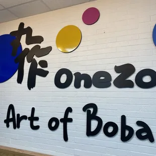 a wall with a sign that says art of boba