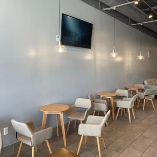 a row of tables and chairs in a restaurant