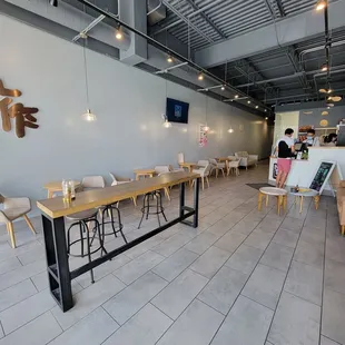 a dining area with tables and chairs