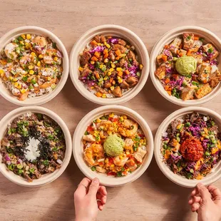 four bowls of different types of food