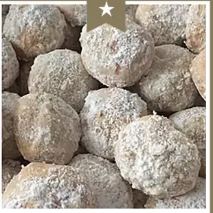 a pile of powdered sugared donuts