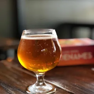 a glass of beer on a table