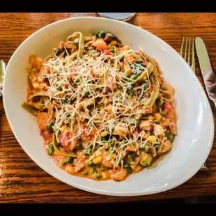 Chicken + shrimp + veggies + spinach pasta + marinara  sauce + pesto sauce = Delicious!