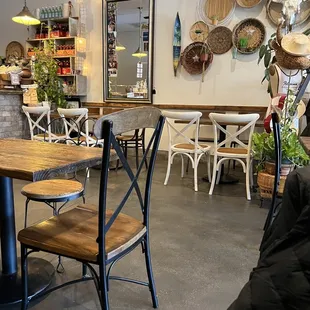 a dining area with tables and chairs