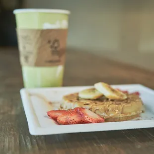 a plate of food and a cup of coffee