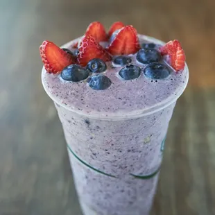 a smoothie with strawberries and blueberries