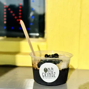 a cup of ice cream with a spoon in it