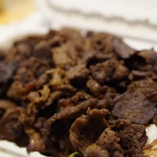 beef and rice in a styrofoam container