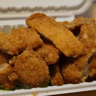 chicken nuggies in a styrofoam container